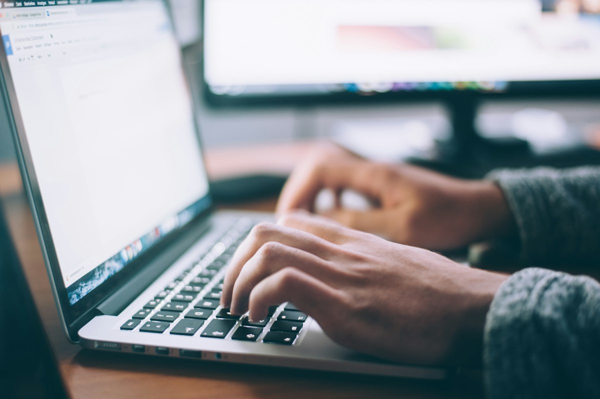 Person working on a laptop during a focused planning session